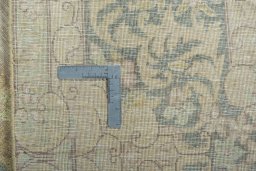 Backside of handmade 1970s Kerman rug showing knot structure and weave density