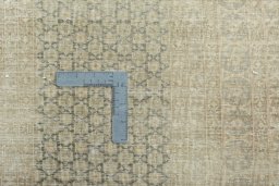 Backside of handmade 1970s Kerman rug showing knot structure and weave density