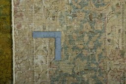 Backside of handmade 1970s Kerman rug showing knot structure and weave density