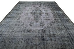 Surface texture of 1970s Kerman rug with natural Wool and intricate pattern