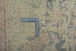Backside of handmade 1970s Kerman rug showing knot structure and weave density