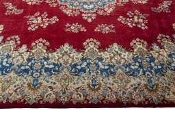 Corner detail of 2000s Kerman rug showing border pattern and Wool pile