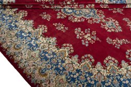 Close-up detail of 2000s Kerman rug from Iran / Persia showing Wool weave