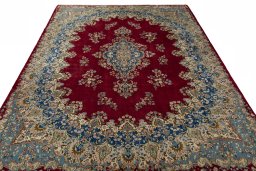 Surface texture of 2000s Kerman rug with natural Wool and intricate pattern