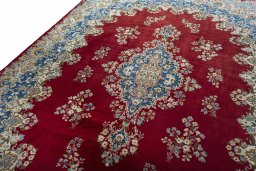Backside of handmade 2000s Kerman rug showing knot structure and weave density