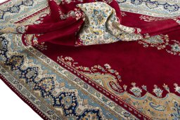 Surface texture of 2000s Kerman rug with natural Wool and intricate pattern
