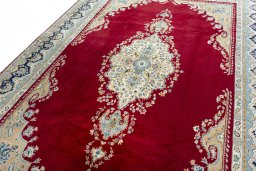 Backside of handmade 2000s Kerman rug showing knot structure and weave density