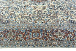 Corner detail of 2000s Kerman rug showing border pattern and Wool pile