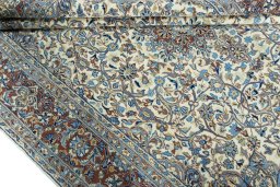 Close-up detail of 2000s Kerman rug from Iran / Persia showing Wool weave