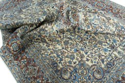 Surface texture of 2000s Kerman rug with natural Wool and intricate pattern