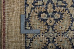 Backside of handmade 1950s Kerman rug showing knot structure and weave density