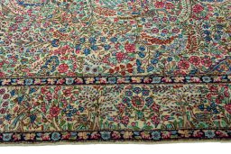 Corner detail of 2000s Kerman rug showing border pattern and Wool pile