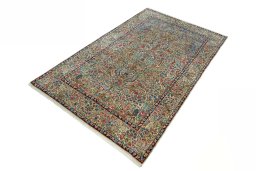 Corner detail of 2000s Kerman rug showing border pattern and Wool pile