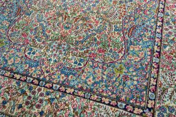 Close-up detail of 2000s Kerman rug from Iran / Persia showing Wool weave