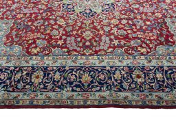 Corner detail of 2000s Kerman rug showing border pattern and Wool pile