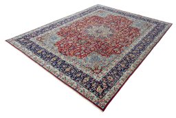 Corner detail of 2000s Kerman rug showing border pattern and Wool pile