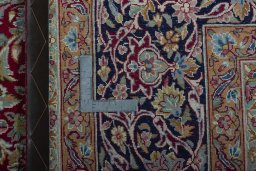 Backside of handmade 2000s Kerman rug showing knot structure and weave density