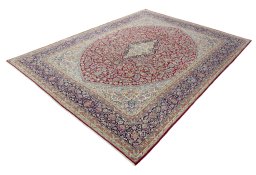 Corner detail of 2000s Kerman rug showing border pattern and Wool pile
