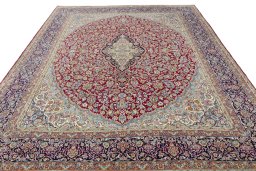 Surface texture of 2000s Kerman rug with natural Wool and intricate pattern