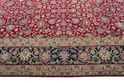 Corner detail of 2000s Kerman rug showing border pattern and Wool pile