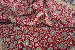Surface texture of 2000s Kerman rug with natural Wool and intricate pattern