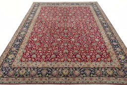 Surface texture of 2000s Kerman rug with natural Wool and intricate pattern