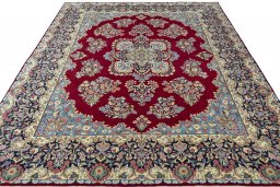 Surface texture of 2000s Kerman rug with natural Wool and intricate pattern