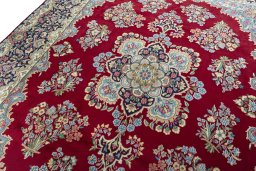 Backside of handmade 2000s Kerman rug showing knot structure and weave density