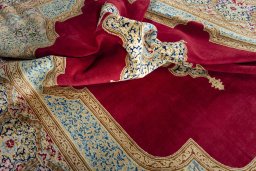 Surface texture of 2000s Kerman rug with natural Wool and intricate pattern