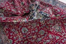 Surface texture of 2000s Kerman rug with natural Wool and intricate pattern
