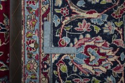 Backside of handmade 2000s Kerman rug showing knot structure and weave density