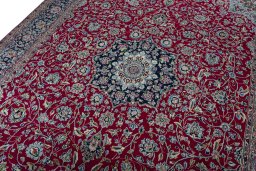 Backside of handmade 2000s Kerman rug showing knot structure and weave density
