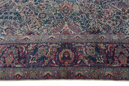 Corner detail of 1930s Kerman rug showing border pattern and Wool pile