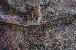 Surface texture of 1930s Kerman rug with natural Wool and intricate pattern