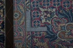 Backside of handmade 1930s Kerman rug showing knot structure and weave density