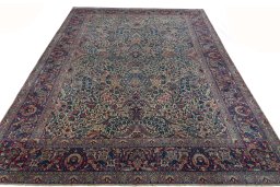 Surface texture of 1930s Kerman rug with natural Wool and intricate pattern