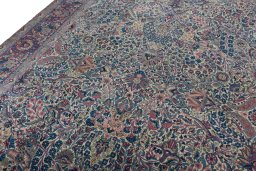 Backside of handmade 1930s Kerman rug showing knot structure and weave density