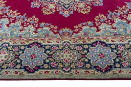 Corner detail of 1970s Kerman rug showing border pattern and Wool pile