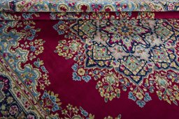 Close-up detail of 1970s Kerman rug from Iran / Persia showing Wool weave