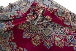 Surface texture of 1970s Kerman rug with natural Wool and intricate pattern