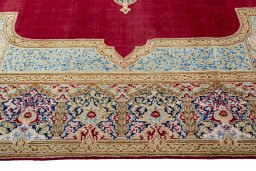 Corner detail of 2000s Kerman rug showing border pattern and Wool pile