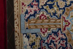 Backside of handmade 2000s Kerman rug showing knot structure and weave density