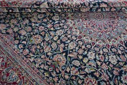 Close-up detail of 2000s Kerman rug from Iran / Persia showing Wool weave