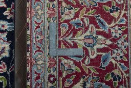 Backside of handmade 2000s Kerman rug showing knot structure and weave density