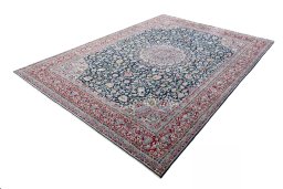 Corner detail of 2000s Kerman rug showing border pattern and Wool pile