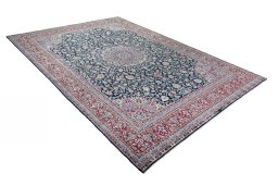 Close-up detail of 2000s Kerman rug from Iran / Persia showing Wool weave