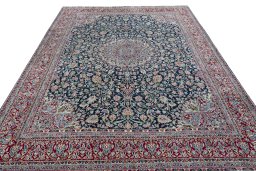 Surface texture of 2000s Kerman rug with natural Wool and intricate pattern