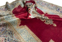 Surface texture of 2000s Kerman rug with natural Wool and intricate pattern