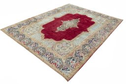 Corner detail of 2000s Kerman rug showing border pattern and Wool pile