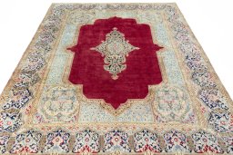 Surface texture of 2000s Kerman rug with natural Wool and intricate pattern